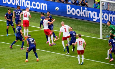 Poland's Adam Buksa (No 16) scores his side's goal with a header from a corner.