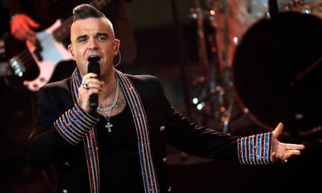 Robbie Williams on stage.