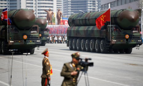 North Korea’s intercontinental ballistic missiles are driven past leader Kim Jong-un during a military parade in Pyongyang, North Korea, in 2017. 