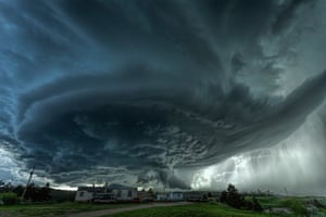 A supercell thunderstorm rises over the town of Blackhawk, South Dakota.