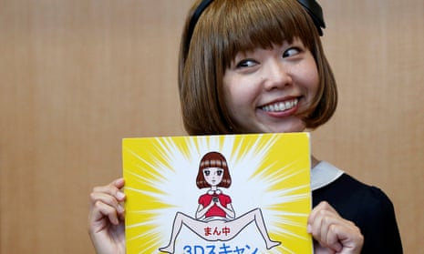 Japanese artist Megumi Igarashi, known as Rokudenashiko, holds her artwork after a news conference following a court appearance in Tokyo April 15, 2015.