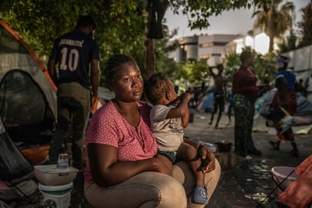 Salma, a 28-year-old Nigerian woman, with her son