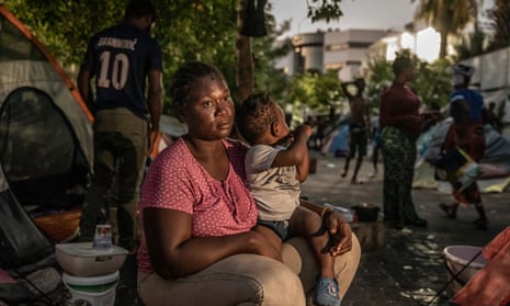 Salma, a 28-year-old Nigerian woman with his son camping in front of OIM office in Tunis.