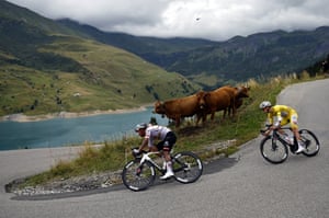 Tadej Pogacar, wearing the overall leader’s yellow jersey (right) and UAE Team Emirate teammate Jhonatan Narvae on the descent after the Cormet de Roseland.