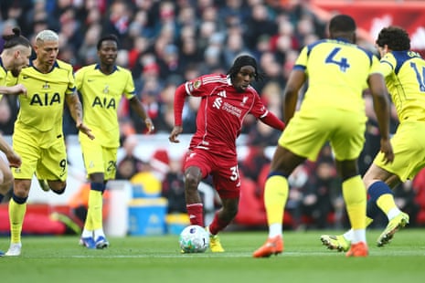 Jeremie Frimpong is crowded out by the Tottenham team.