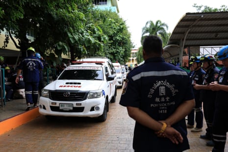 Emergency personnel work on the site of a shooting at the Debsirin Nonthaburi School in Nonthaburi province.