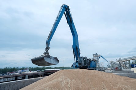 An excavator loads grain into a cargo ship in Izmail.
