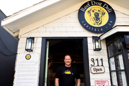 Anthony Kresge, the owner of Reef Dog Deli in Capitola, California, welcomes locals and visitors alike after the severe storms.