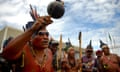 BRAZIL-NATIVES-PROTEST<br>Brazilian natives dance during a protest in front of Planalto Palace, in Brasilia, on November 06, 2012. Indigenous from the Kanela, Gaviao and Guajajara ethnic groups, from the state of Maranhoo, northeastern Brazil, protest asking for the demarcation of their indigenous landsc as they are in dispute with white local ranchers. AFP PHOTO/PEDRO LADEIRA (Photo credit should read PEDRO LADEIRA/AFP/Getty Images)