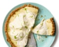 Felicity Cloake's key lime pie on a green plate, with slices cut off