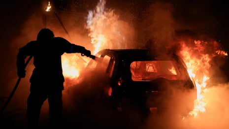 French police fire teargas and protesters burn cars on fifth night of riots – video