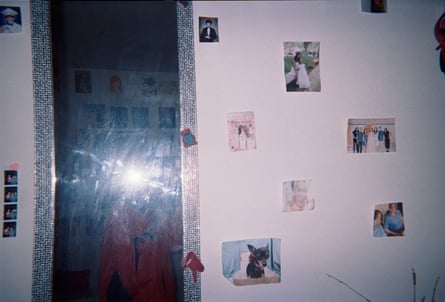 Friends and family photos adorn the wall in Linda’s bedroom.