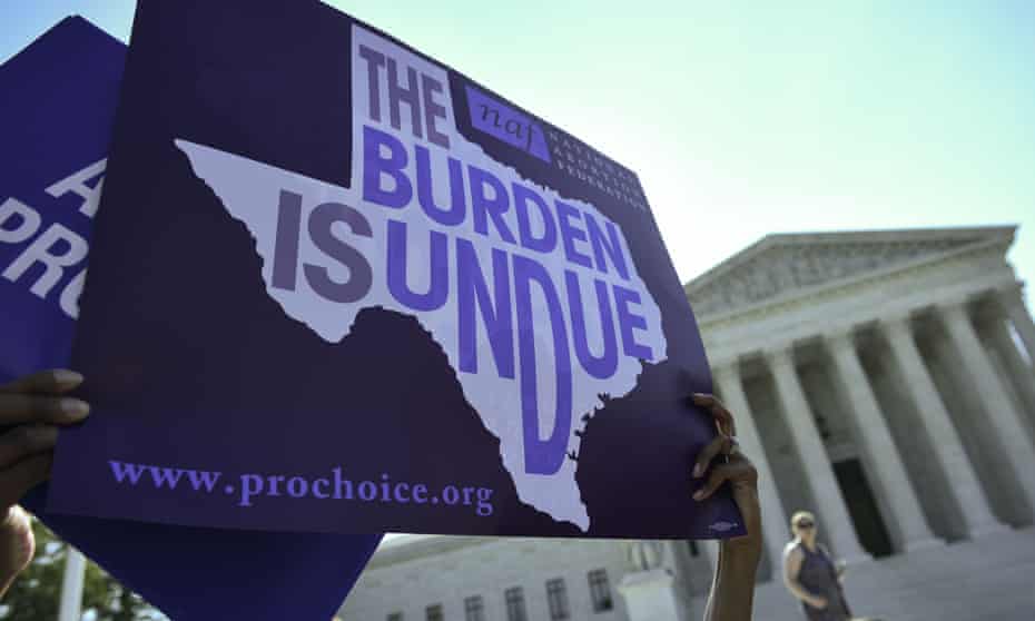 An abortion rights activist holds a sign outside of the US supreme court in Washington DC.