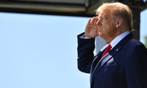 Donald Trump salutes during the national anthem in West Point, New York.
