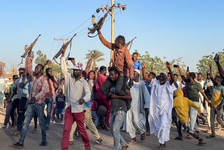 People rally in support of Sudan’s army in Wad Madani in December 2023.