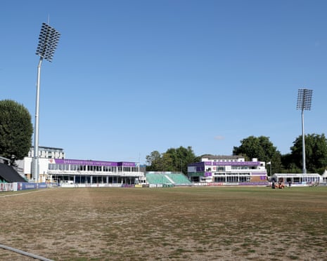 Empty cricket ground with pavilion buildings and floodlights at the Ambassador Cruise Line Ground