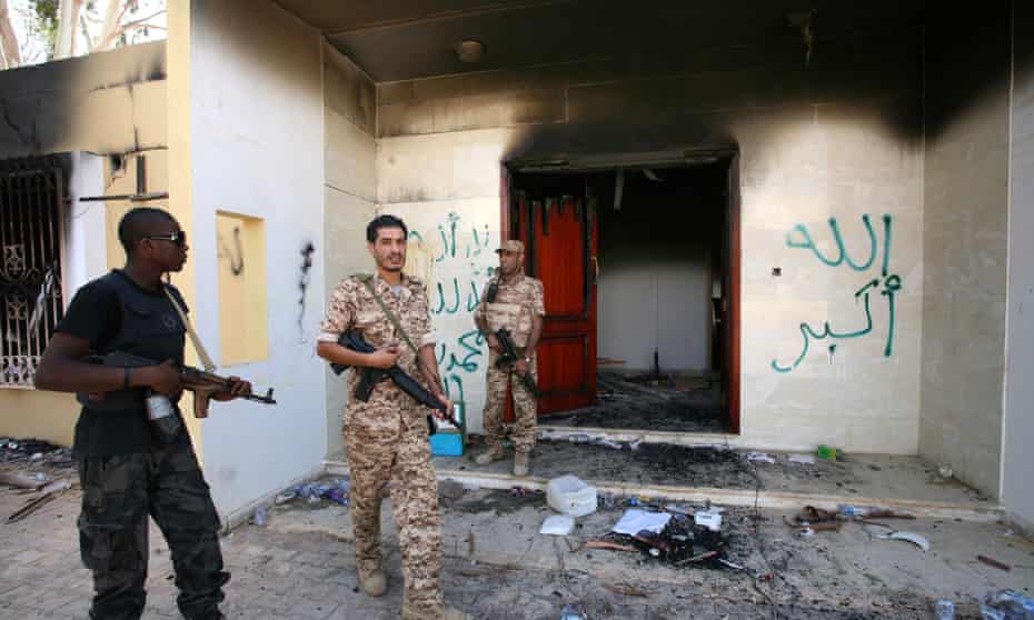 Libyan military guards check one of the US consulate’s burnt-out buildings in Benghazi, Libya, in 2012.