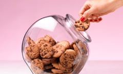 Hand in a jar of biscuits