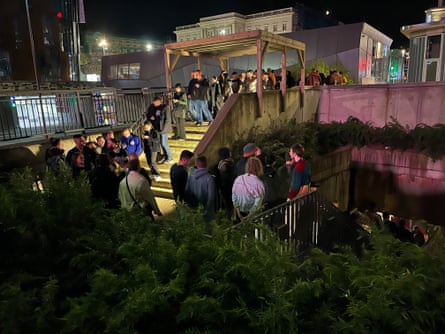 Clubbers queue to get in.