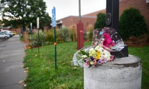 Flowers sit outside the Dar Al Farooq Center Islamic Center, the scene of an explosion caused by ‘an improvised explosive device’.