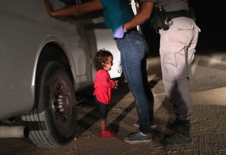 Another image in Moore’s set of the two-year-old Honduran asylum and her mother