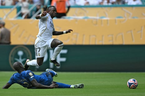 Vinicius Junior is tackled by Kalidou Koulibaly.