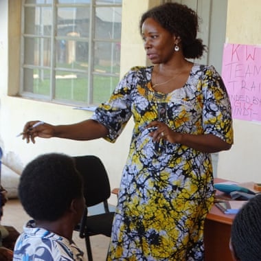 An African woman addressing other women 