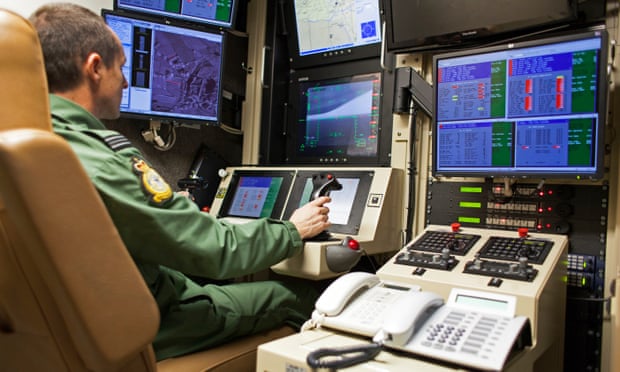 A Reaper drone operator inside a control cabin at RAF Waddington.