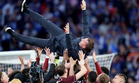 Brendan Rodgers being tossed in the air by his Leicester players after winning the FA Cup in 2021.