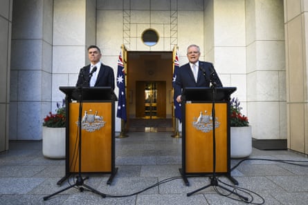 Australian Prime Minister Scott Morrison (right) and Australia’s Chief Medical Officer Brendan Murphy speak to the media during a press conference at Parliament House in Canberra, Wednesday, March 18, 2020.
