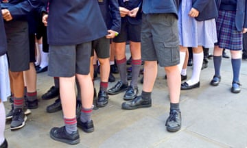 London,England, UK. Primary school children in uniform - anonymous feet and legs<br>MMD10G London,England, UK. Primary school children in uniform - anonymous feet and legs