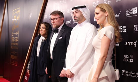 The director Guy Ritchie, centre left, and his wife, the actor Jacqui Ainsley, right, joins the festival’s CEO, Mohammed Al Turki, centre right, on opening night.