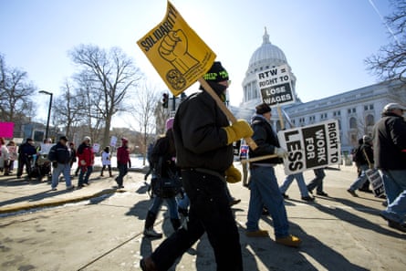 Thousands of union works rally in Wisconsin against a 2015 effort to outlaw mandatory dues.
