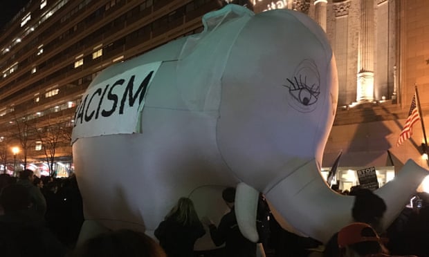 Demonstrators parade an inflatable elephant outside the DeploraBall for Trump supporters in Washington DC.