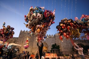 Vendors sell balloons as Palestinians celebrate Eid al-Fitr at Damascus Gate in Old City, Jerusalem