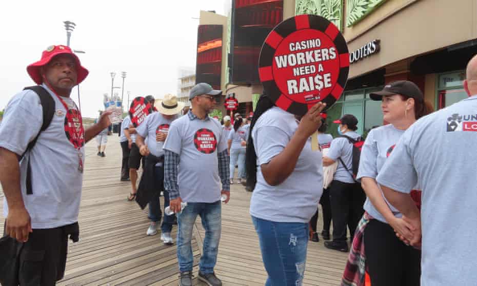 Members of Local 54 of the Unite Here casino workers union picket outside the Tropicana casino in Atlantic City, New Jersey, on 1 June.