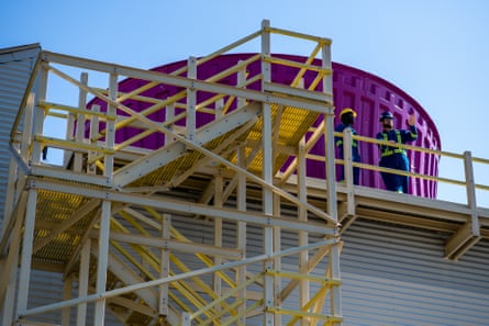 A large air-intake mechanism with stairs built around it.