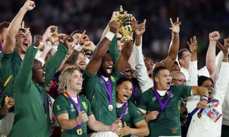The South Africa captain, Siya Kolisi, lifts the Webb Ellis Cup after the Springboks’s 32-12 victory.
