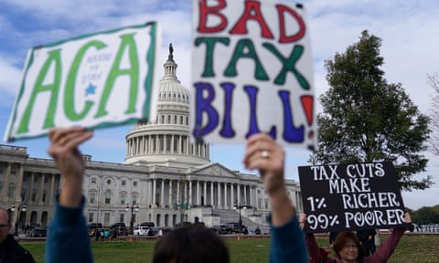 Demonstrators join a rally against the proposed Republican tax reform legislation in Washington Wednesday.