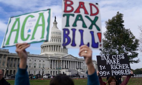 Demonstrators join a rally against proposed Republican tax reform legislation in Washington DC on 17 November 2019.