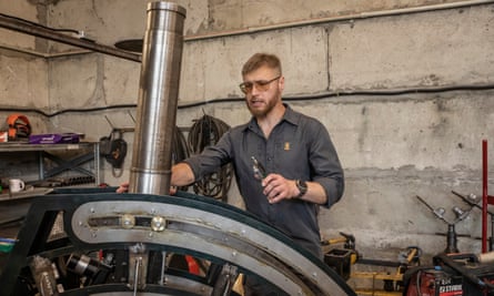 Serhii Biriukov works on an automatic mortar system at the workshop.