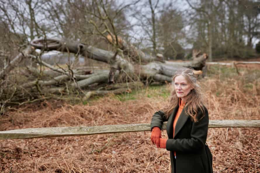 Denise Parker with an old beech that fell in Richmond Park, south-west London