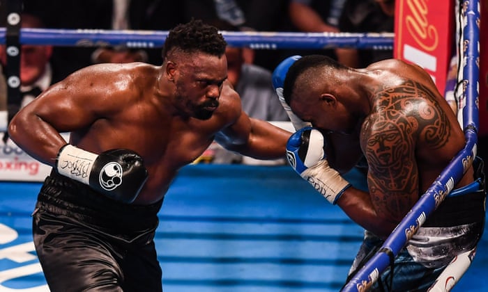Dereck Chisora forces Dillan Whyte onto the ropes in the fifth round.