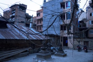 Buddhist stupas are surrounded by new apartment blocks in Kathmandu, Nepal.