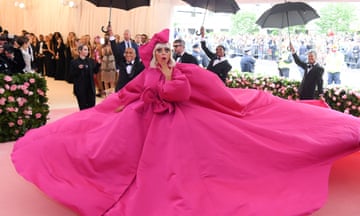 The singer/actor Lady Gaga wears a bright pink gown at the 2019 Met Gala event in New York City.