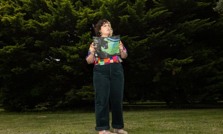 Matilda Boseley with a map in front of trees