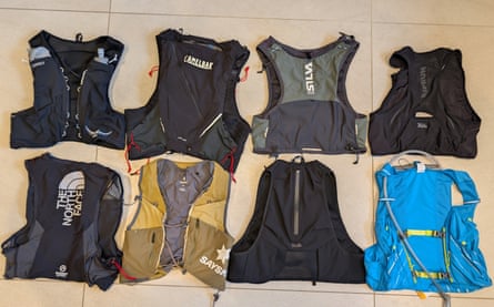 Eight running and hydration vests in two rows.