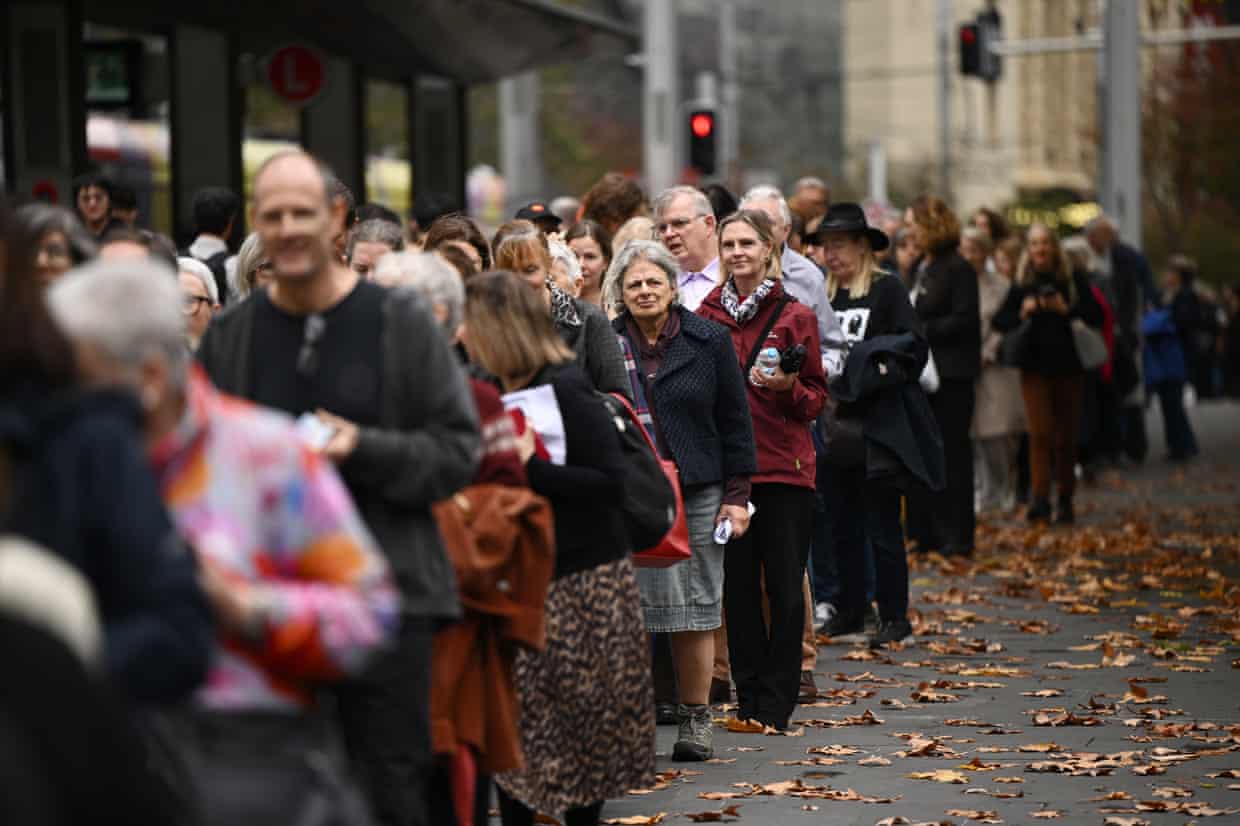 Mourners queue outside the Sydney town hall.