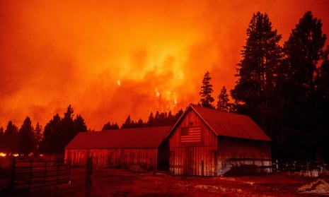 Flames consume multiple homes as the Caldor fire pushes into the Echo Summit area, California, last month.