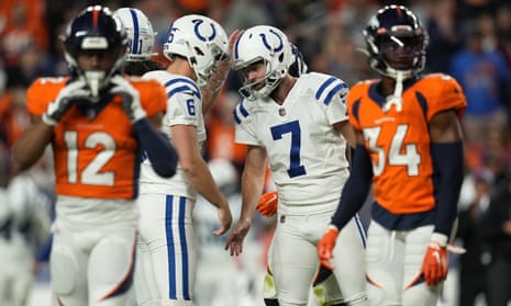 Indianapolis Colts kicker Chase McLaughlin (7) celebrates his field goal with punter Matt Haack in overtime